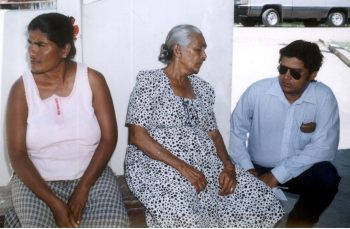  Neil Kumar as he comforts the missing taxi driver's grandmother.